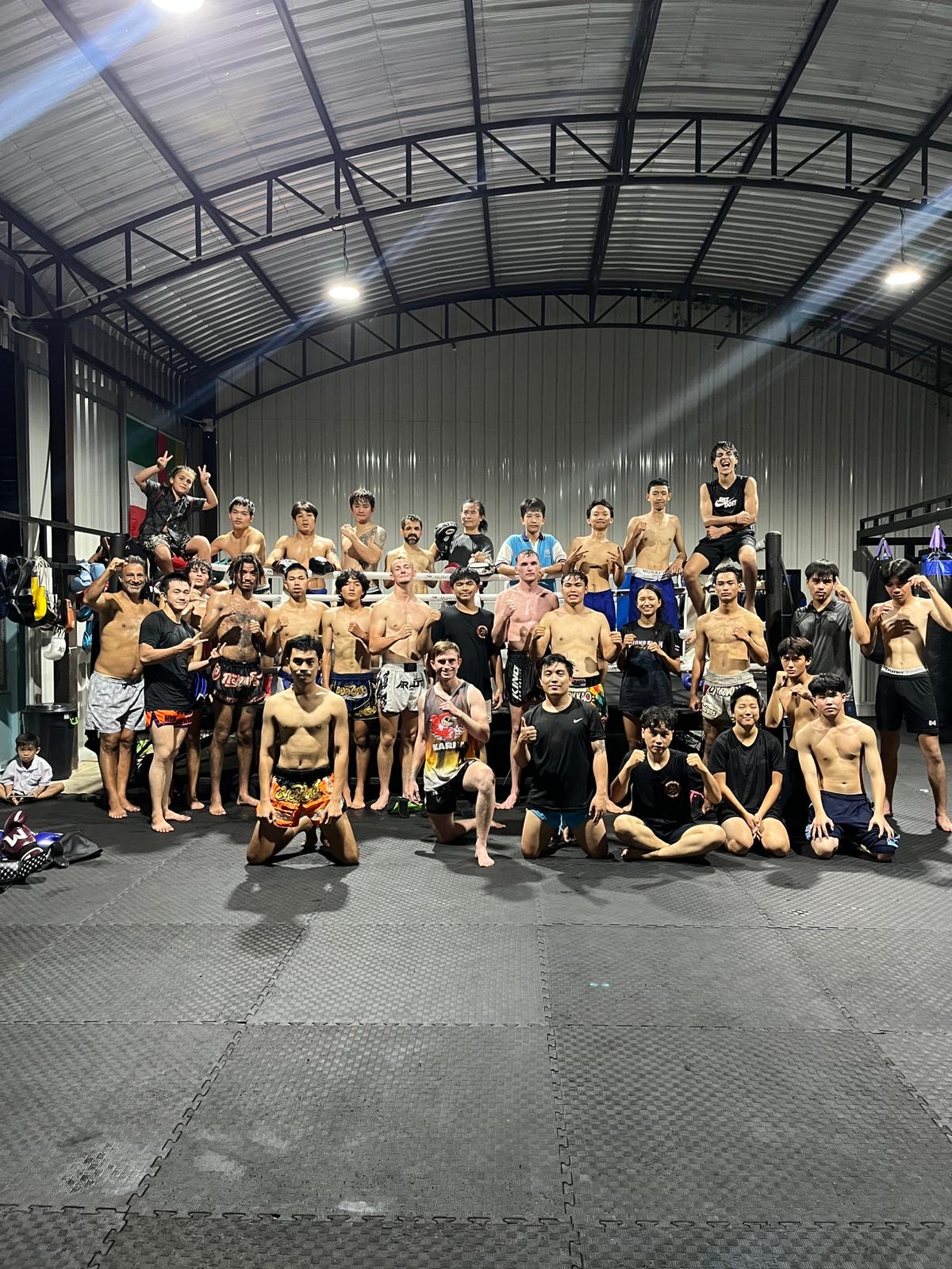 Changpuak Muay Thai team group photo in the gym